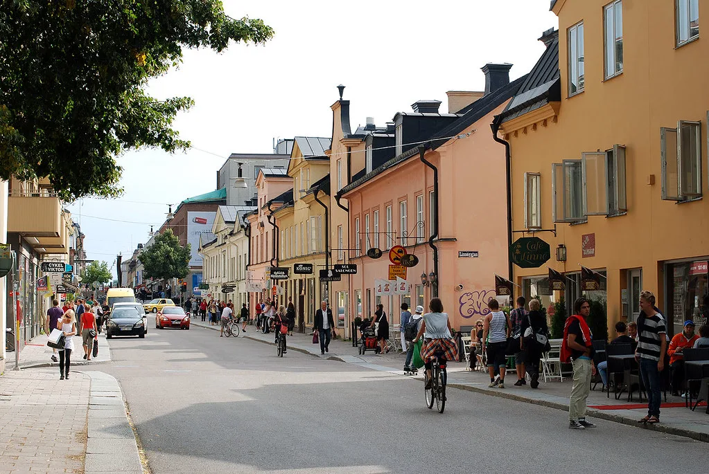 A street of cafés and shops in Uppsala.
