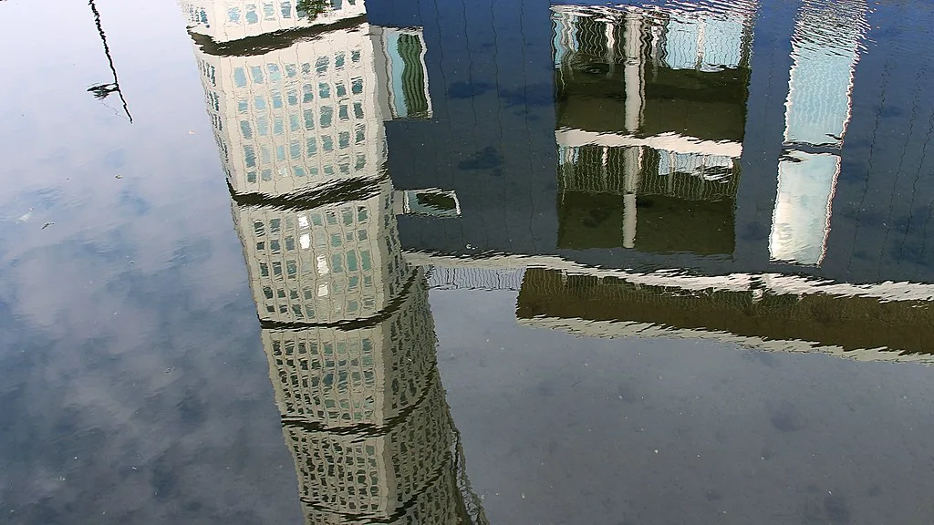 The Turning Torso reflected in a Malmö canal.