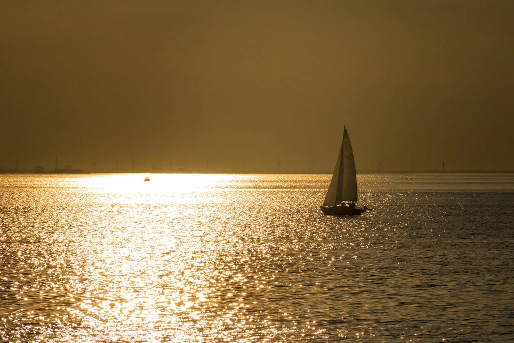 A sailboat at sunset off Västra Hamnen, Malmö.