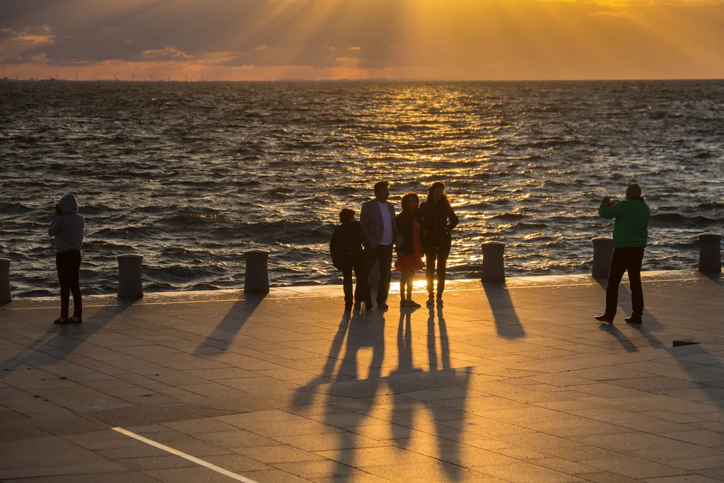 People watching the sunset at Västra Hamnen, Malmö.