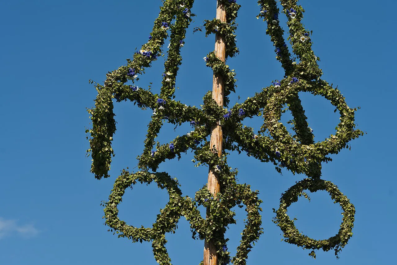 A Midsummer pole with flower crowns at Skansen.