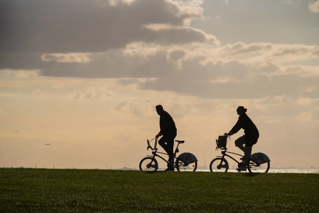 Cyclists silhouetted at Västra Hamnen, Malmö.