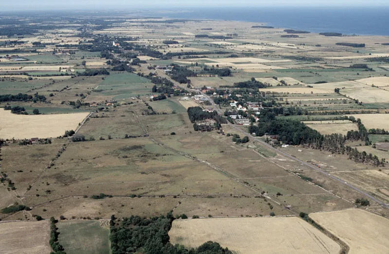 Farmland and villages on the Swedish plain from the air.