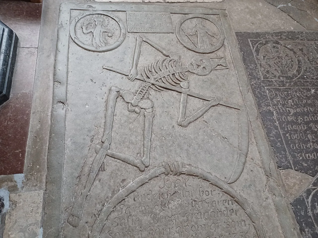 A carved tombstone in St Peter's Church, Malmö.