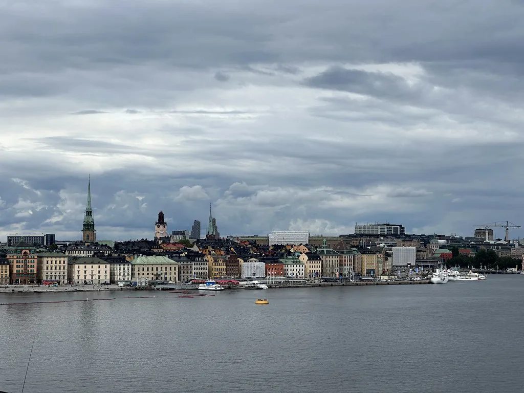 Stockholm's old town under a cloudy sky.