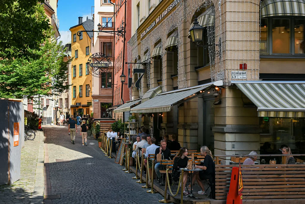 Café terraces on a Gamla Stan street, Stockholm.
