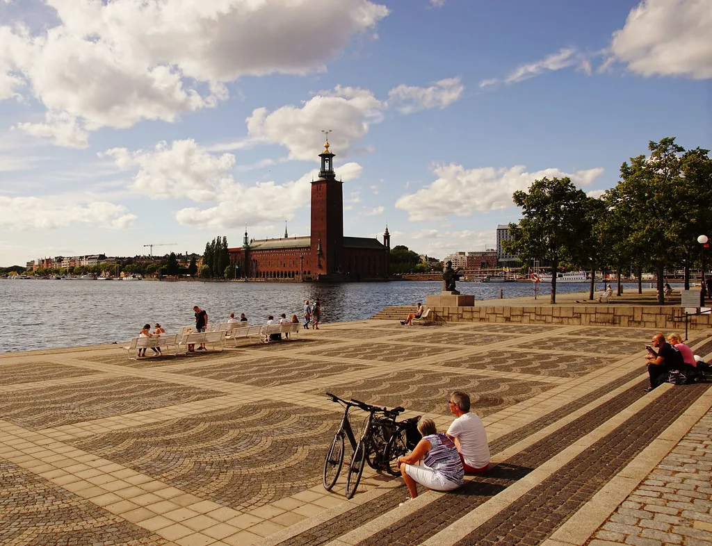 Stockholm City Hall across the water in autumn sun.