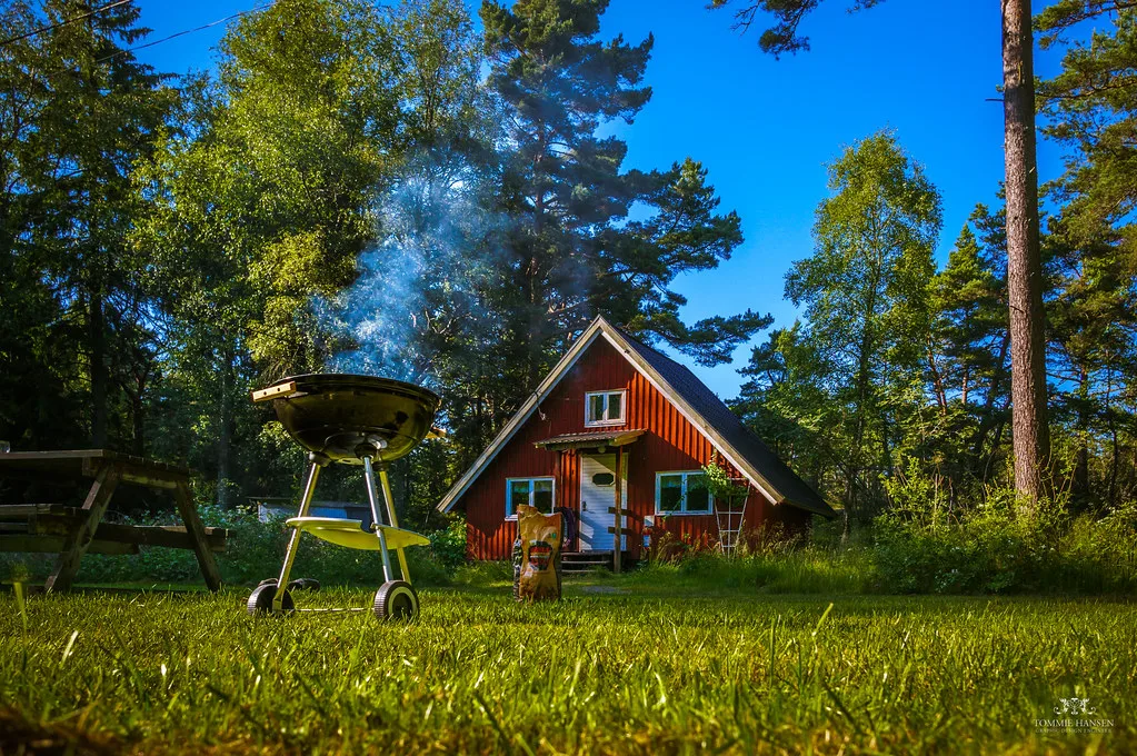 A red cottage and barbecue at Fjärdlång, Stockholm archipelago.