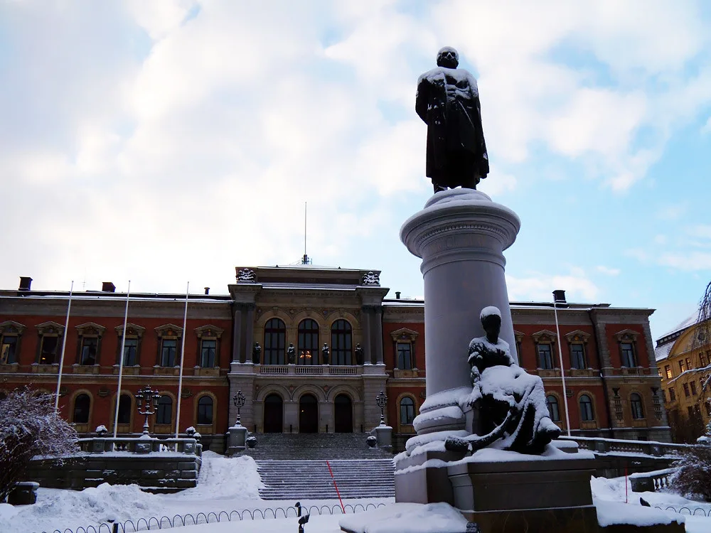 Uppsala University's main building and statue.